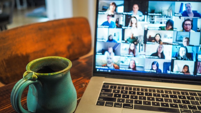 Person working from home with a laptop on the kitchen table